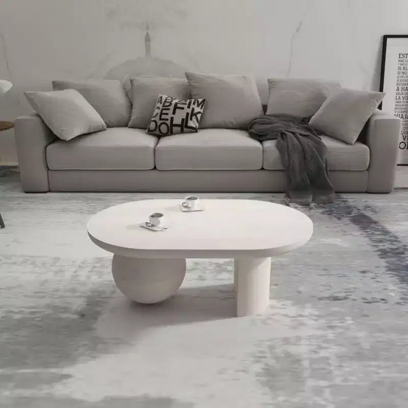 Table basse ovale en manguier de 38 po avec pieds sphériques, blanc délavé